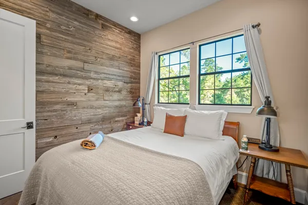 a bedroom with a bed and a window