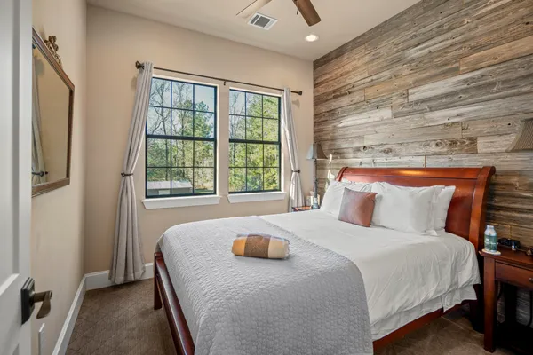 a bedroom with a bed and a window