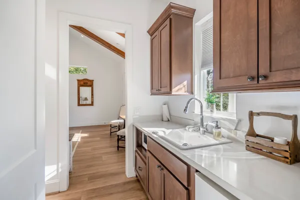 a en suite bathroom with a sink and a mirror