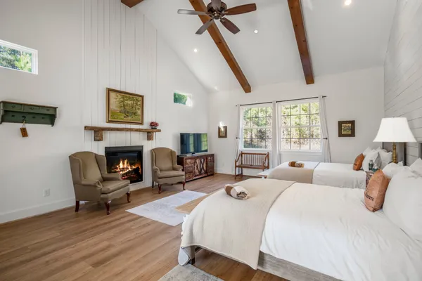 a bedroom with furniture and a fireplace