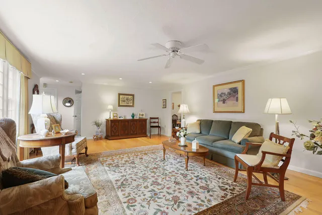 a kitchen with stainless steel appliances a dining table and chairs