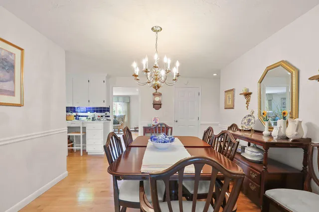 a view of a dining room with furniture and a potted plant