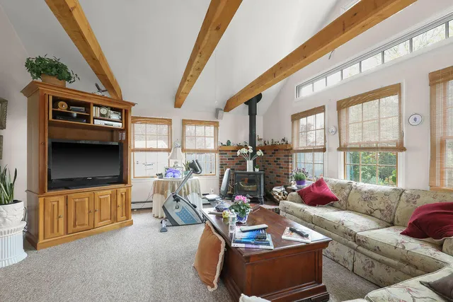 a bedroom with bed and window