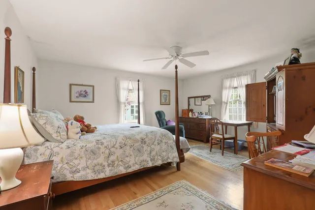 a bedroom with a bed and a table in it