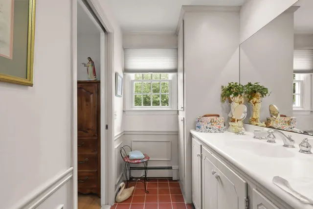a living room with furniture and a gym machine