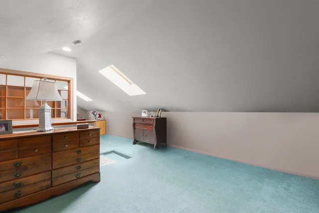 a view of a table and chairs on the roof deck