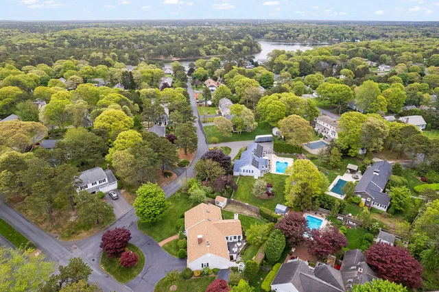 an aerial view of residential houses with outdoor space