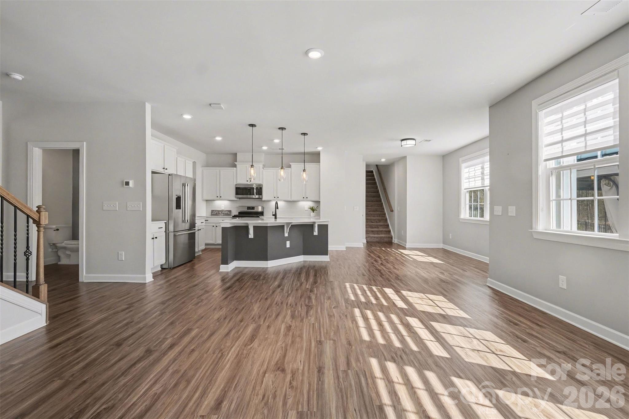 14510 Grundys Way Davidson, NC 28036 - Photo 15 of 43 a view of kitchen view wooden floor and window