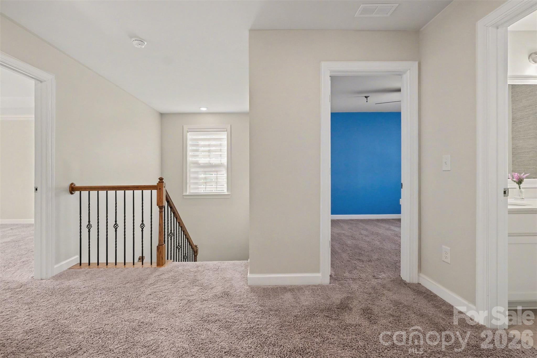 14510 Grundys Way Davidson, NC 28036 - Photo 19 of 43 a view of a hallway to rooms and stairs