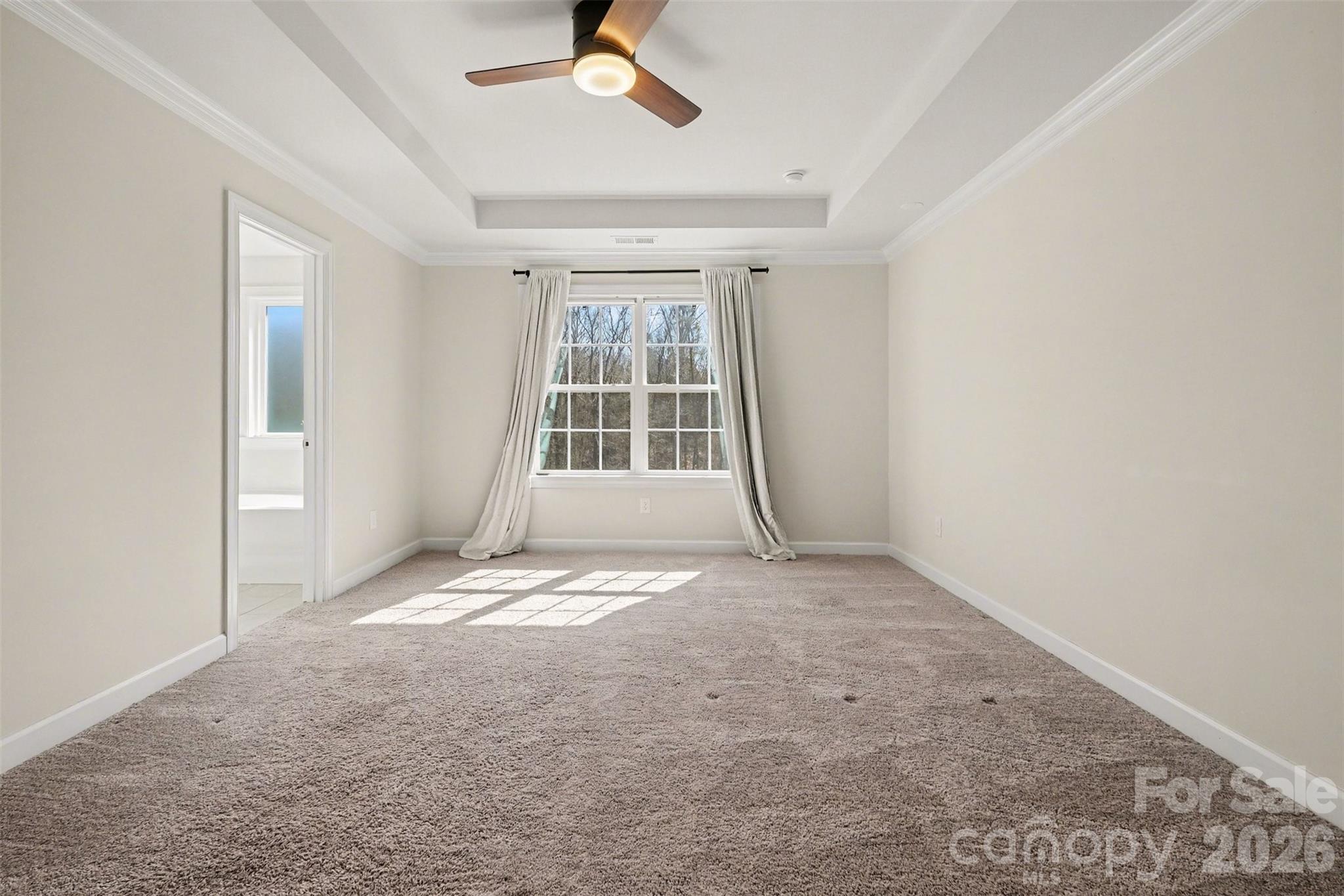 14510 Grundys Way Davidson, NC 28036 - Photo 20 of 43 an empty room with windows and fan