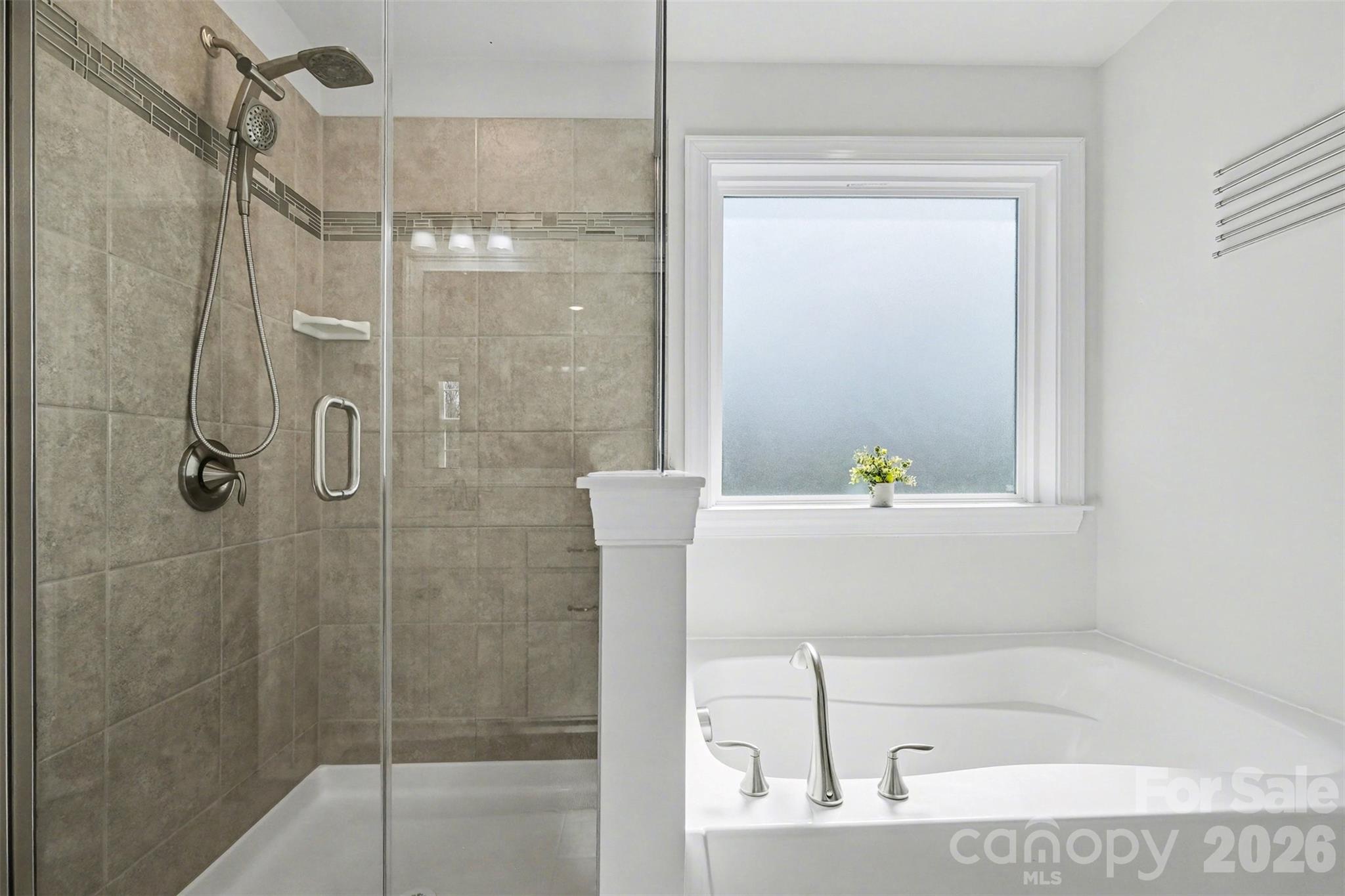 14510 Grundys Way Davidson, NC 28036 - Photo 24 of 43 a bathroom with a bathtub and shower