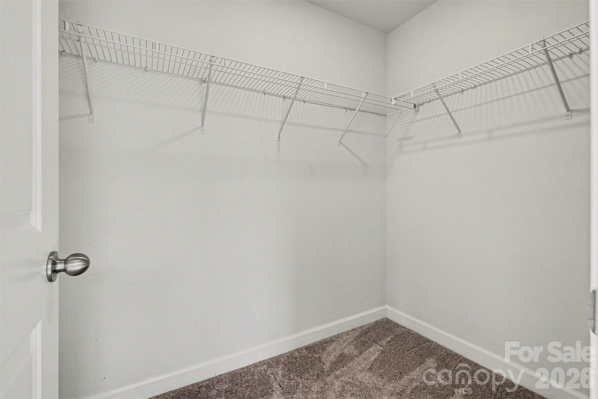 14510 Grundys Way Davidson, NC 28036 - Photo 25 of 43 a view of a room with racks on the wall