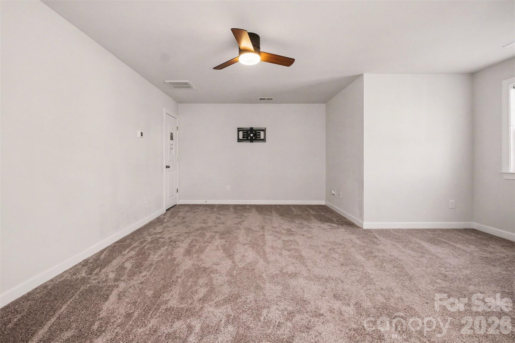 14510 Grundys Way Davidson, NC 28036 - Photo 31 of 43 an empty room with ceiling fan