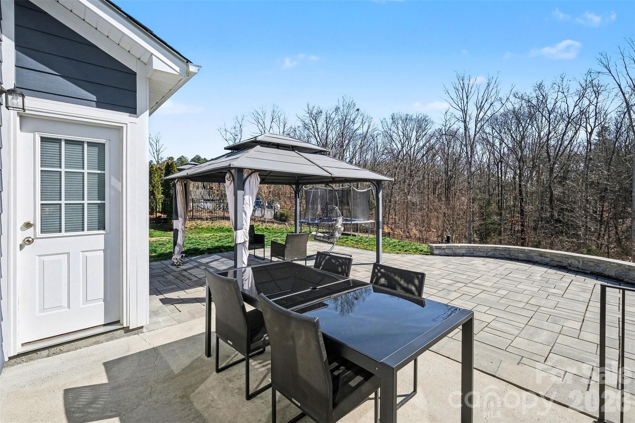 14510 Grundys Way Davidson, NC 28036 - Photo 33 of 43 a backyard of a house with table and chairs