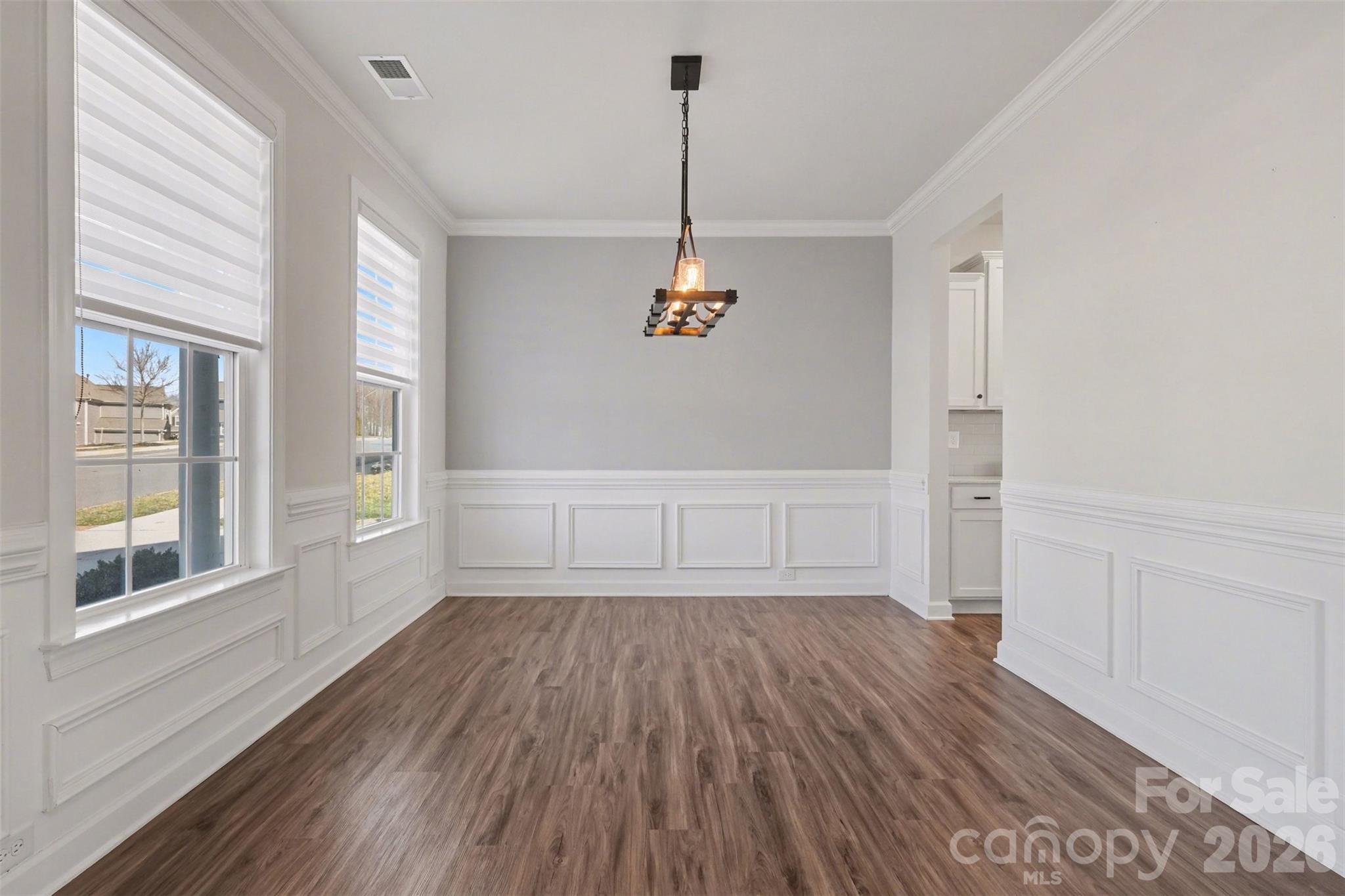 14510 Grundys Way Davidson, NC 28036 - Photo 4 of 43 a view of empty room with wooden floor and fan