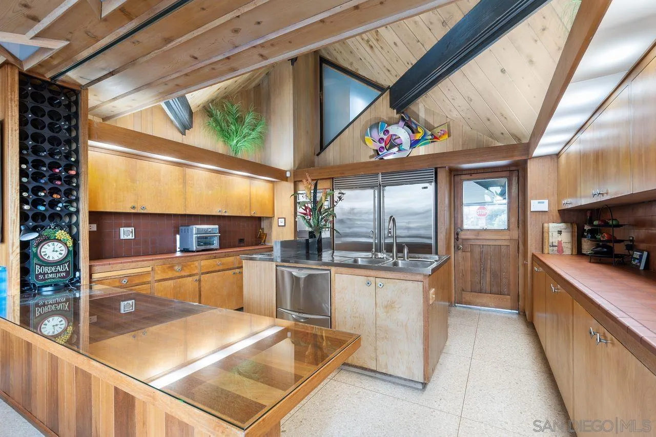 2694 Bayside Walk San Diego, CA 92109 - Photo 20 of 37 a kitchen with stainless steel appliances granite countertop a refrigerator and a stove top oven