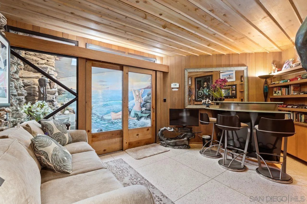 2694 Bayside Walk San Diego, CA 92109 - Photo 22 of 37 a living room with furniture and a floor to ceiling window