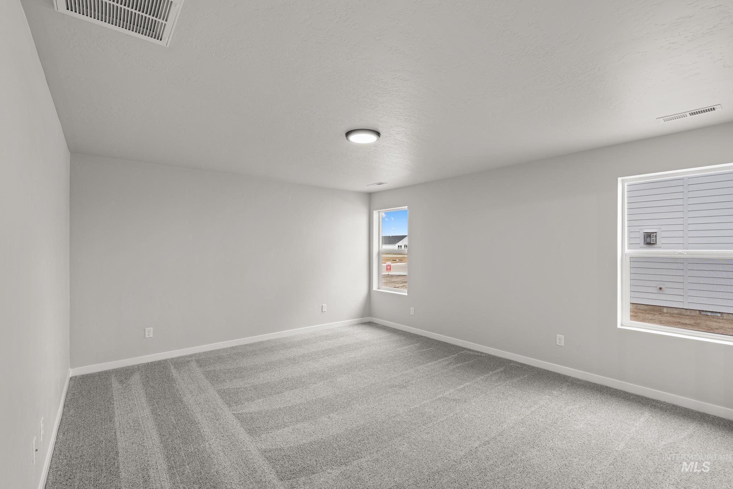 1449 Covington Street Middleton, ID 83644 - Photo 14 of 21 Unfurnished room with light carpet and baseboards