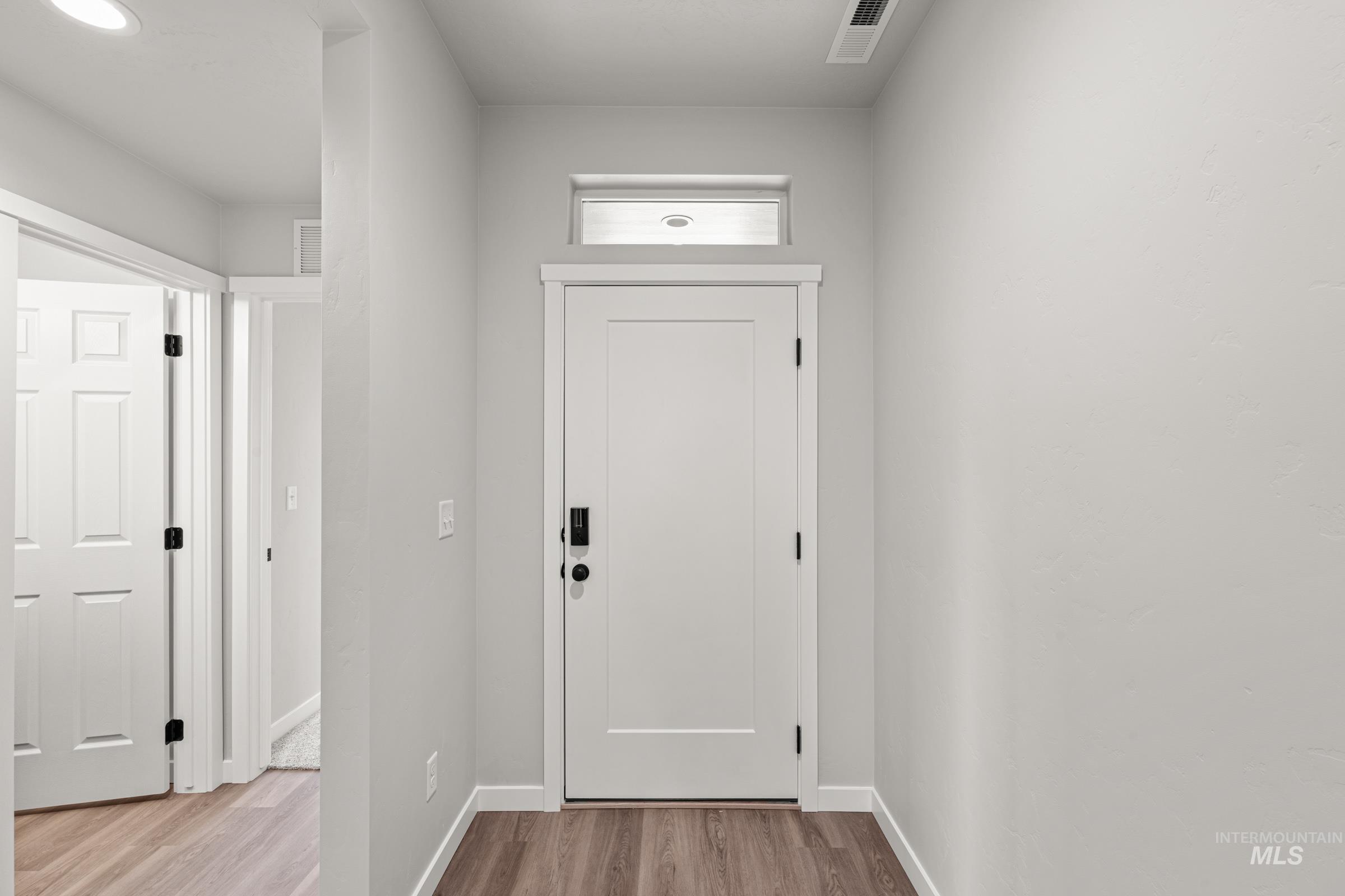 1449 Covington Street Middleton, ID 83644 - Photo 2 of 21 Doorway featuring wood finished floors and baseboards