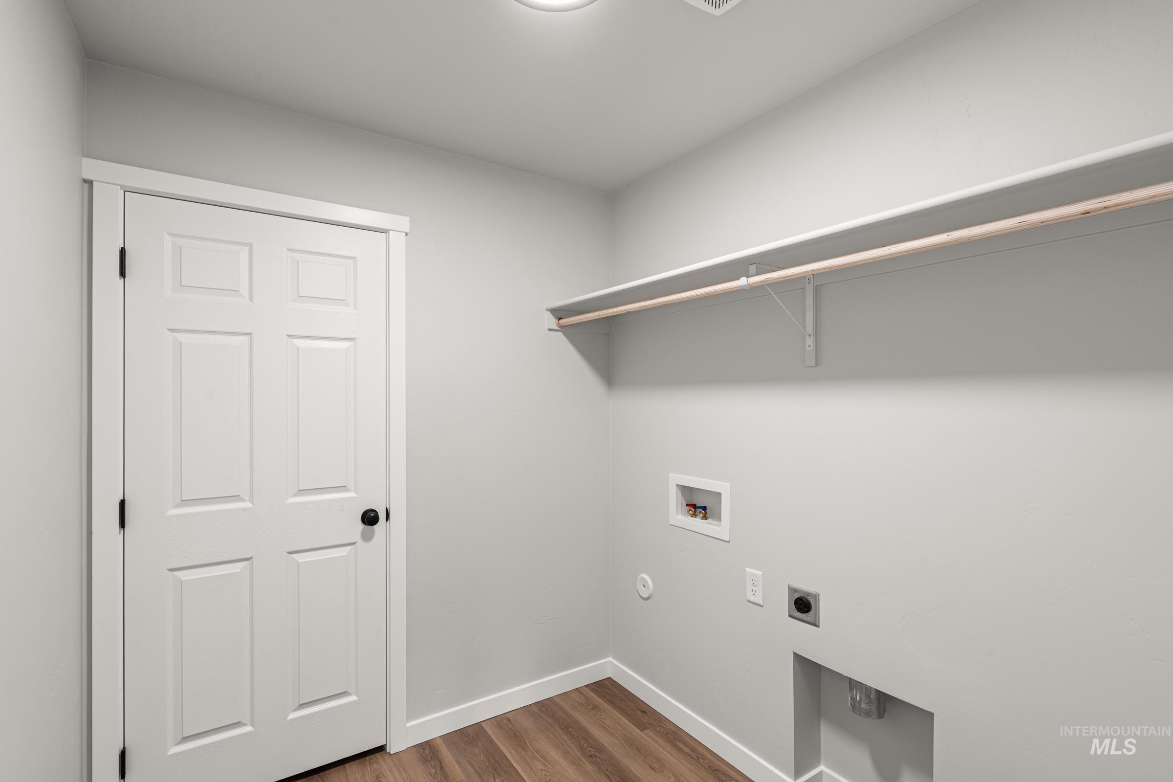1449 Covington Street Middleton, ID 83644 - Photo 10 of 21 Laundry area featuring wood finished floors, hookup for an electric dryer, and washer hookup