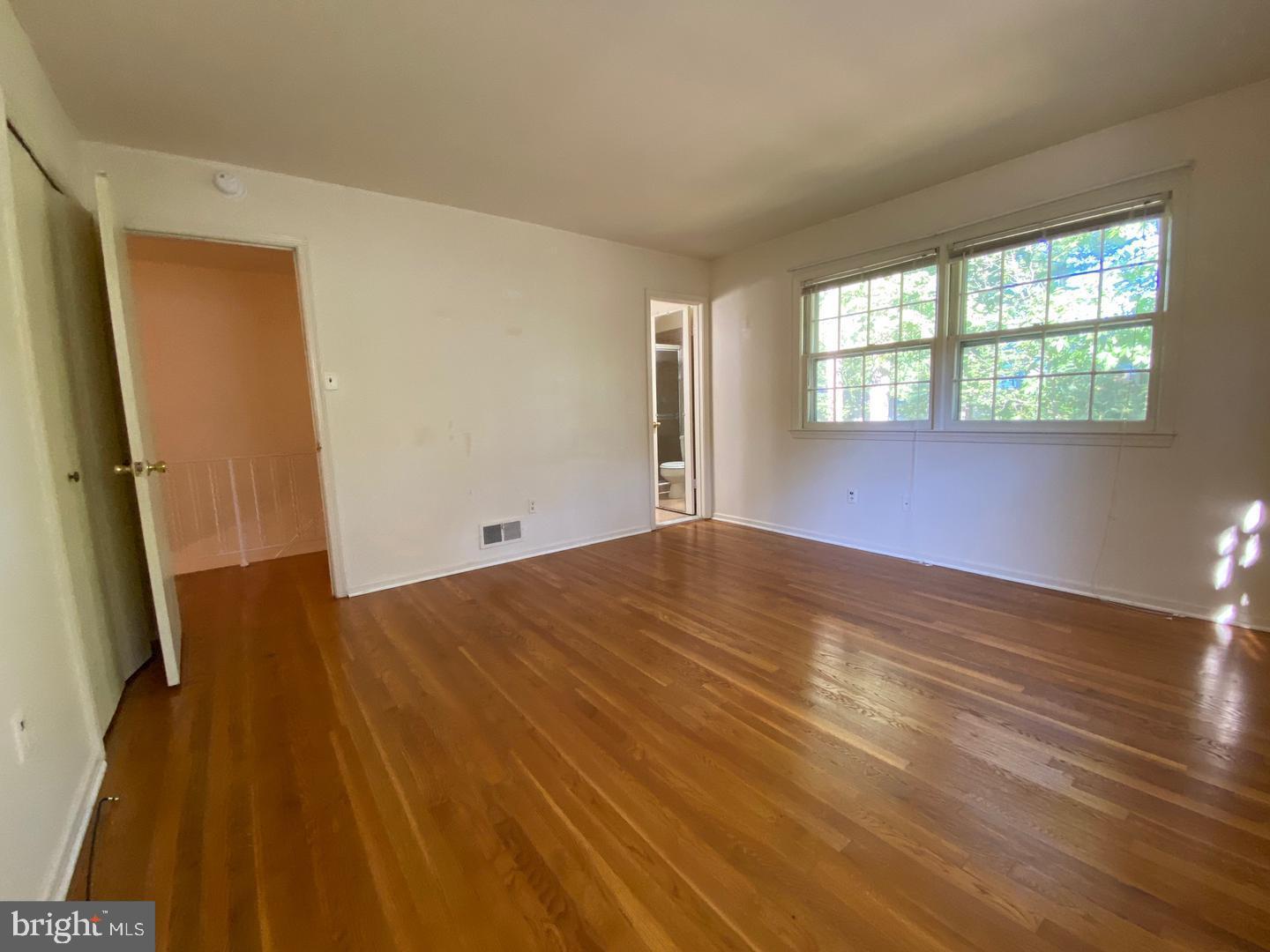 6731 Bellamy Avenue Springfield, VA 22152 - Photo 12 of 19 a view of empty room with wooden floor and fan