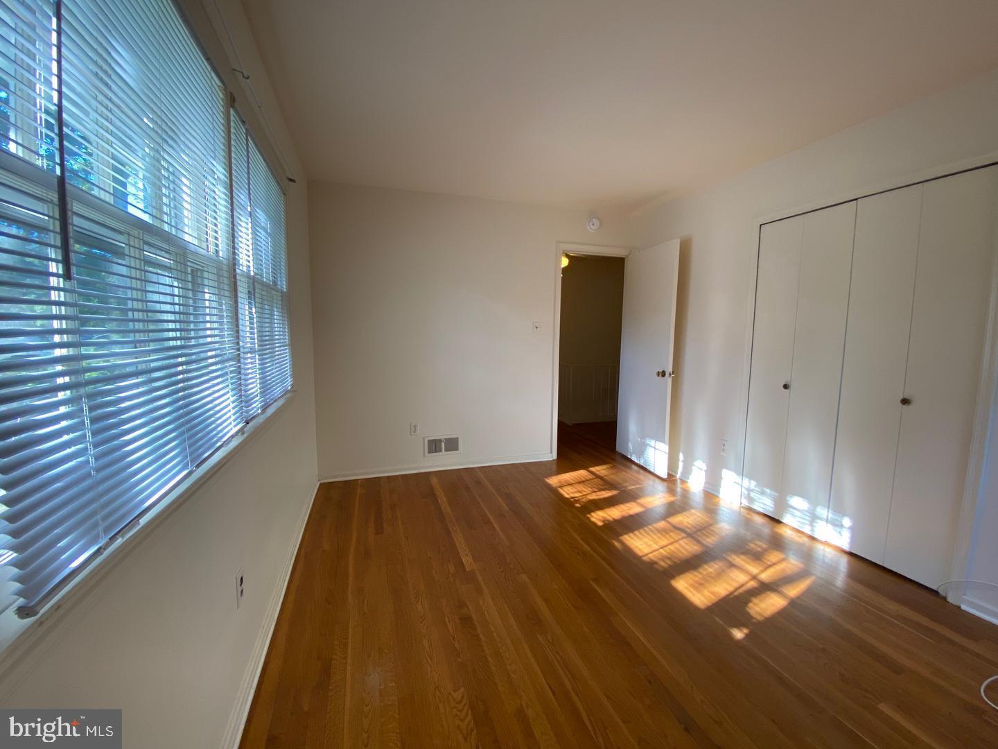 6731 Bellamy Avenue Springfield, VA 22152 - Photo 16 of 19 a view of a bedroom with wooden floor