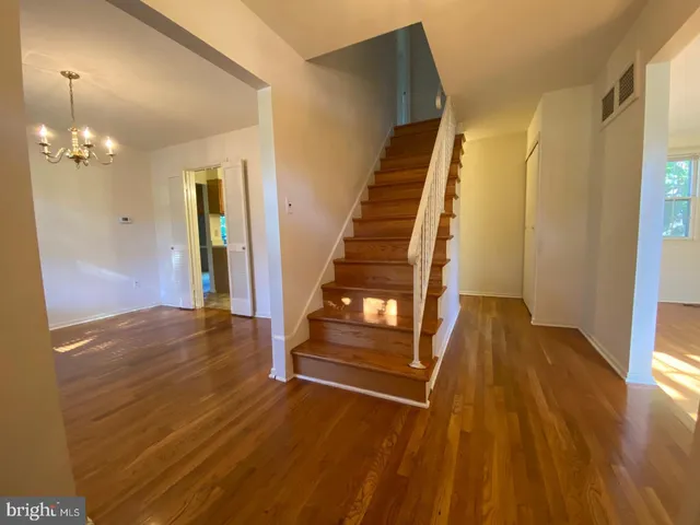 a view of an entryway with wooden floor
