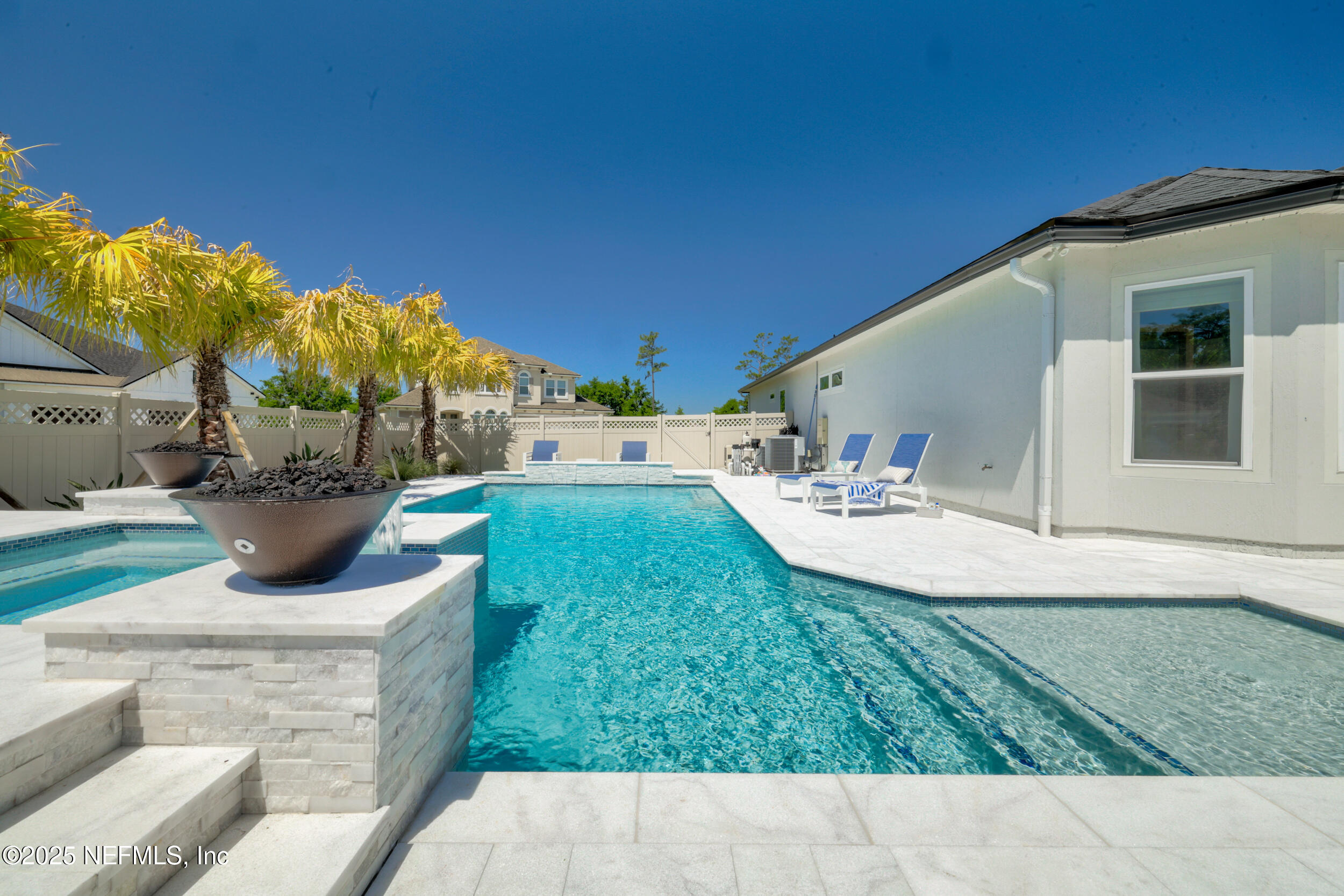 318 Windwalker Drive St. Augustine, FL 32092 - Photo 11 of 54 a view of a backyard with plants and patio