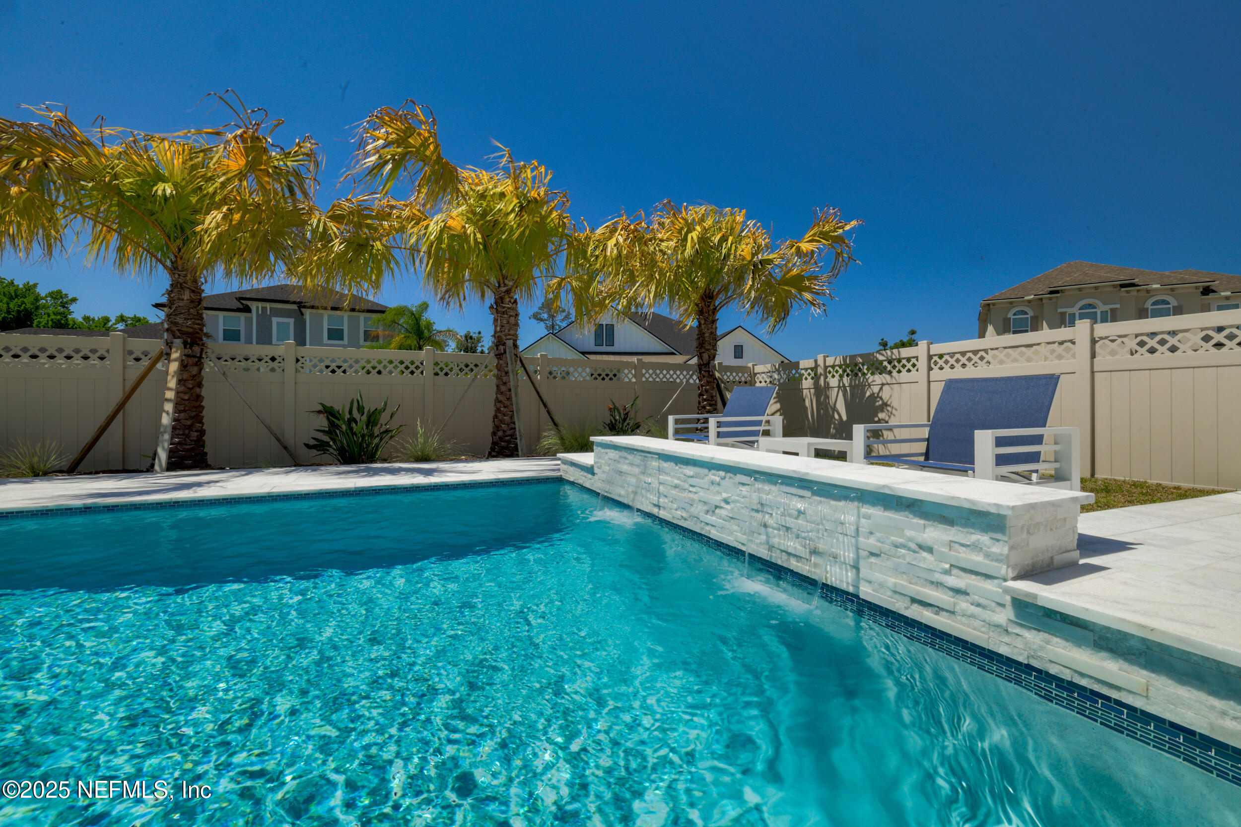 318 Windwalker Drive St. Augustine, FL 32092 - Photo 17 of 54 a swimming pool with outdoor seating and yard