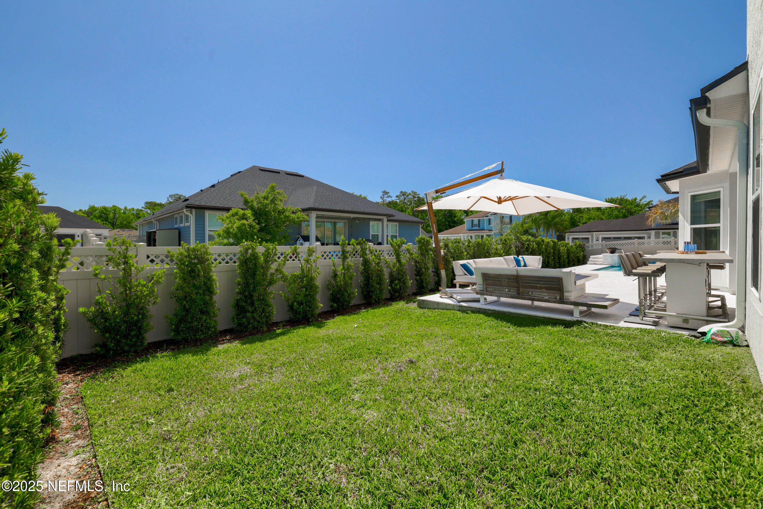 318 Windwalker Drive St. Augustine, FL 32092 - Photo 20 of 54 a view of a house with backyard porch and garden