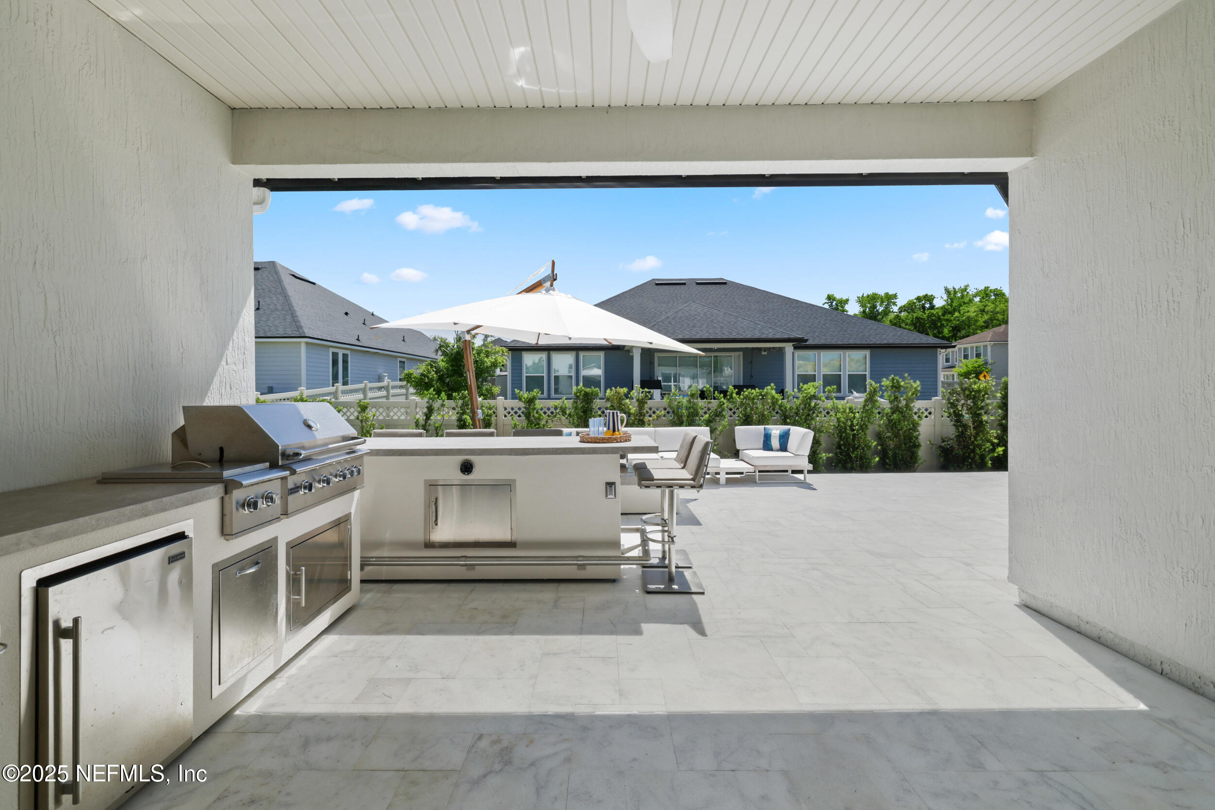318 Windwalker Drive St. Augustine, FL 32092 - Photo 21 of 54 a kitchen with a stove top oven and chairs