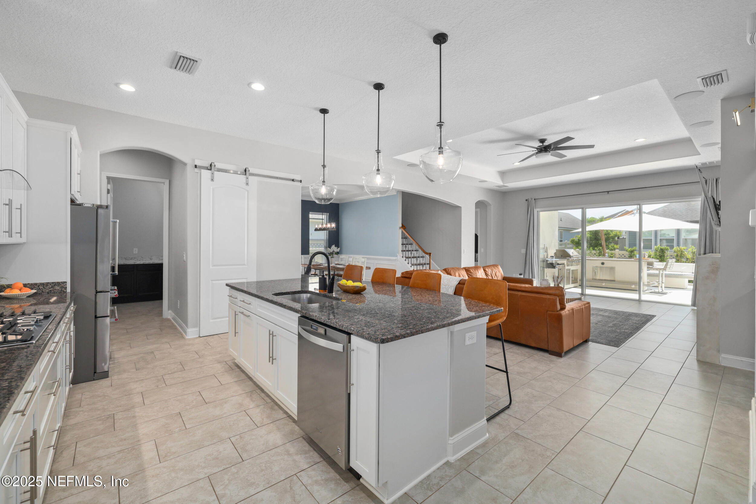 318 Windwalker Drive St. Augustine, FL 32092 - Photo 29 of 54 a open kitchen with stainless steel appliances granite countertop a stove and a sink