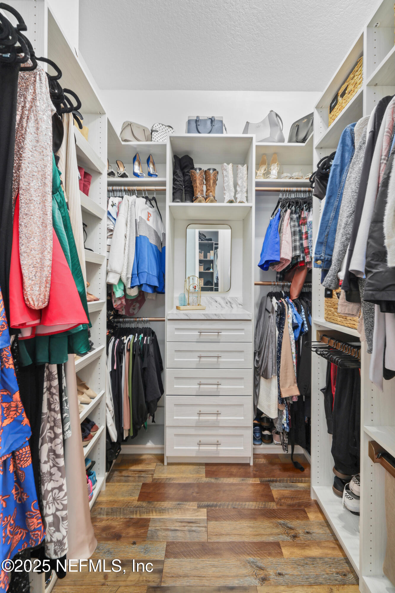 318 Windwalker Drive St. Augustine, FL 32092 - Photo 41 of 54 a view of walk in closet with clothes and shoes