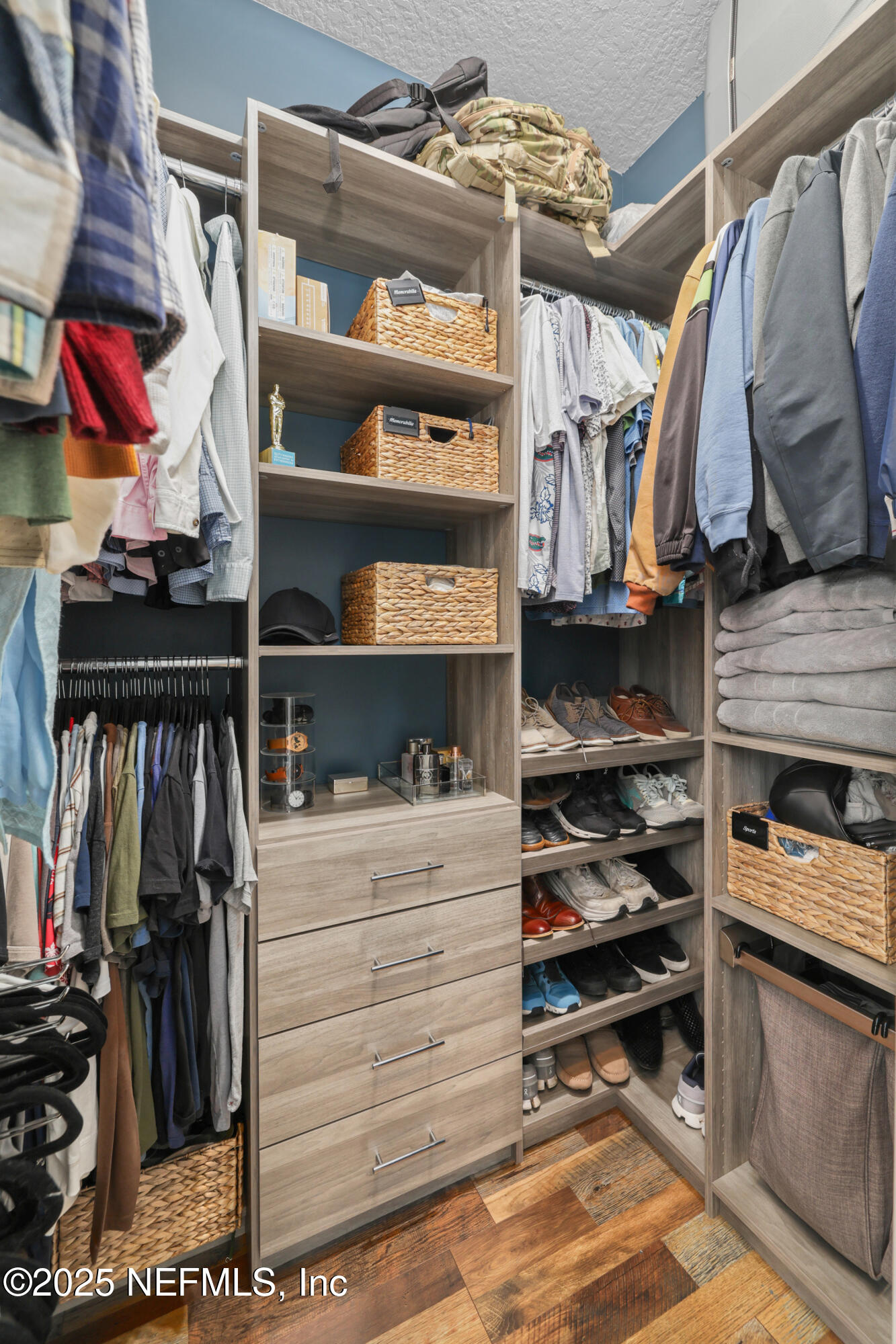 318 Windwalker Drive St. Augustine, FL 32092 - Photo 42 of 54 a view of walk in closet with clothes and shoes