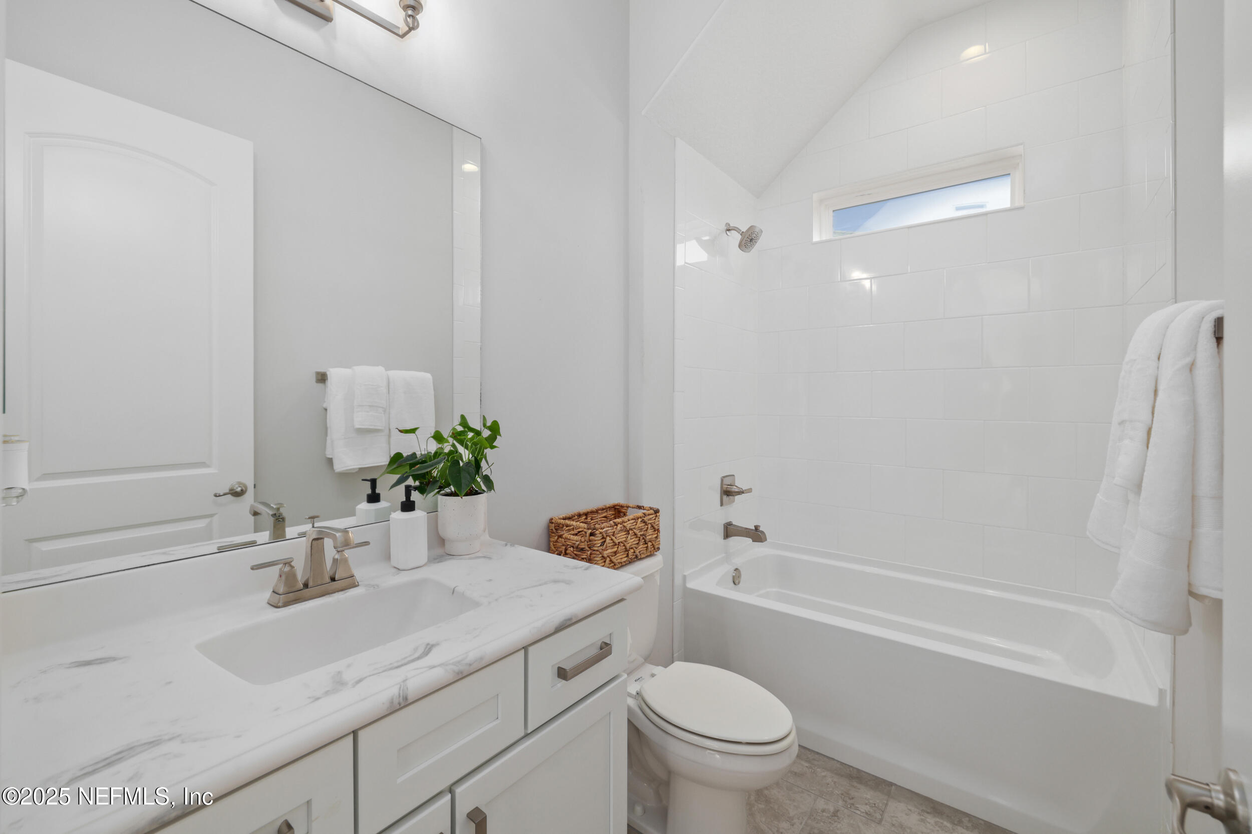 318 Windwalker Drive St. Augustine, FL 32092 - Photo 44 of 54 a bathroom with a sink a toilet and a bathtub