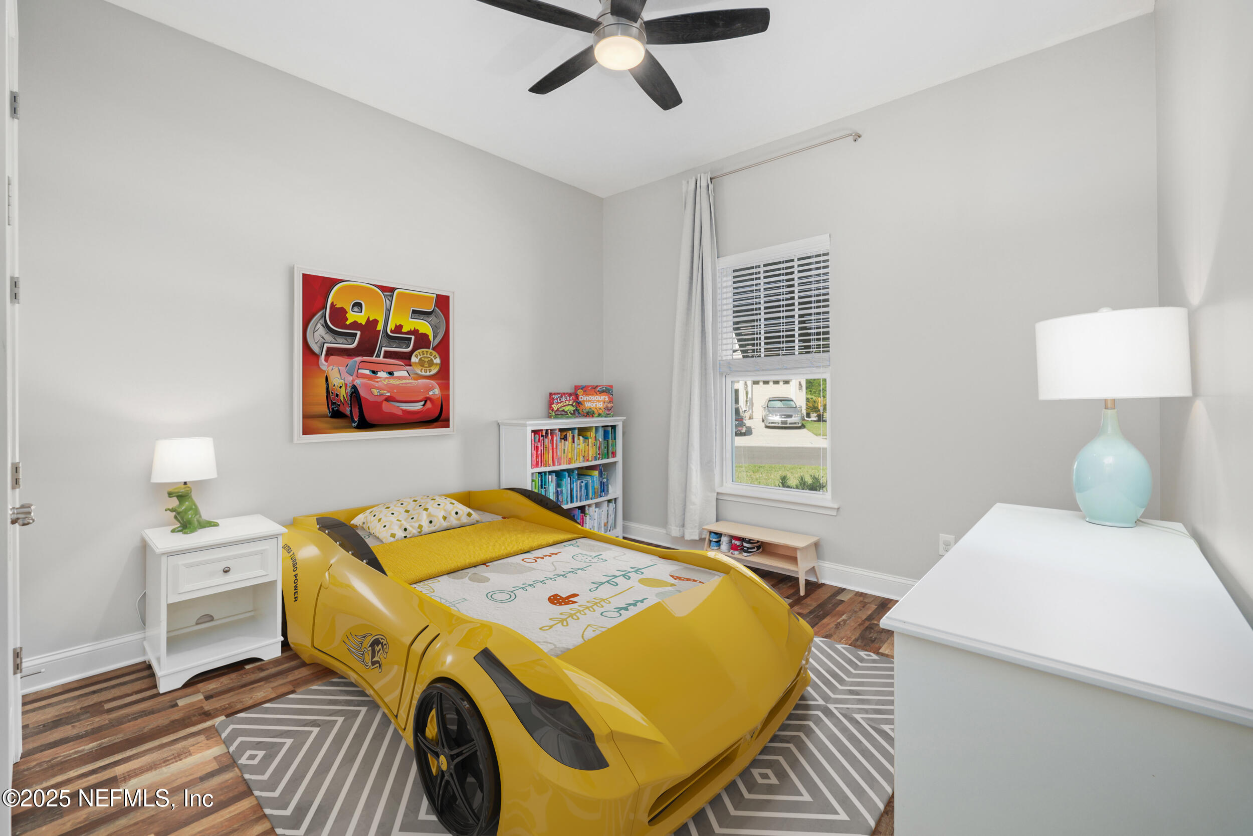 318 Windwalker Drive St. Augustine, FL 32092 - Photo 45 of 54 a bedroom with a bed and a table in it