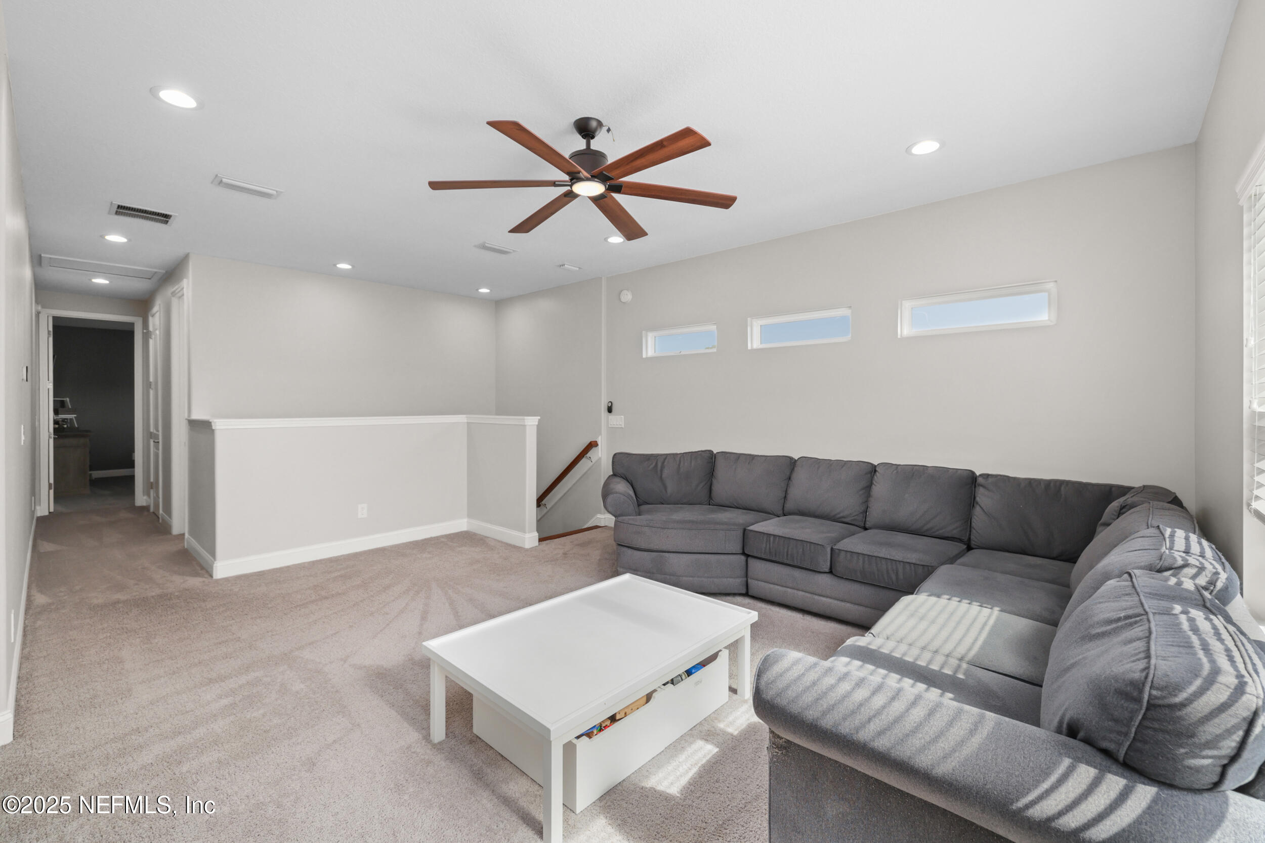 318 Windwalker Drive St. Augustine, FL 32092 - Photo 48 of 54 a living room with furniture and a ceiling fan