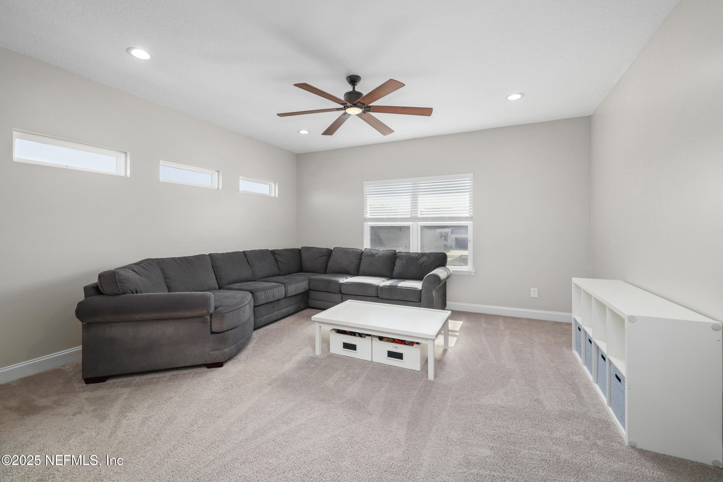 318 Windwalker Drive St. Augustine, FL 32092 - Photo 49 of 54 a living room with furniture and a ceiling fan