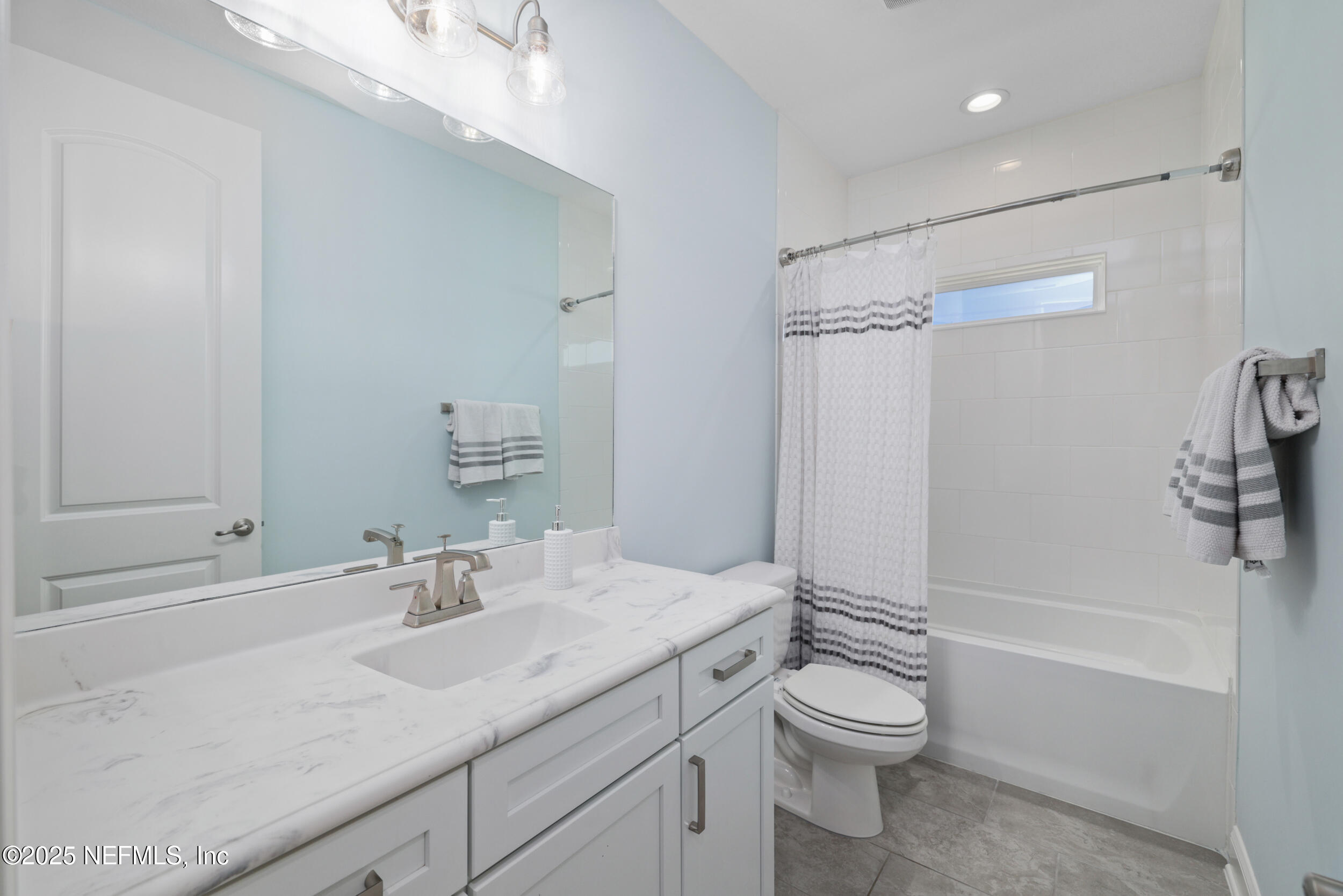 318 Windwalker Drive St. Augustine, FL 32092 - Photo 51 of 54 a bathroom with a granite countertop sink toilet and shower