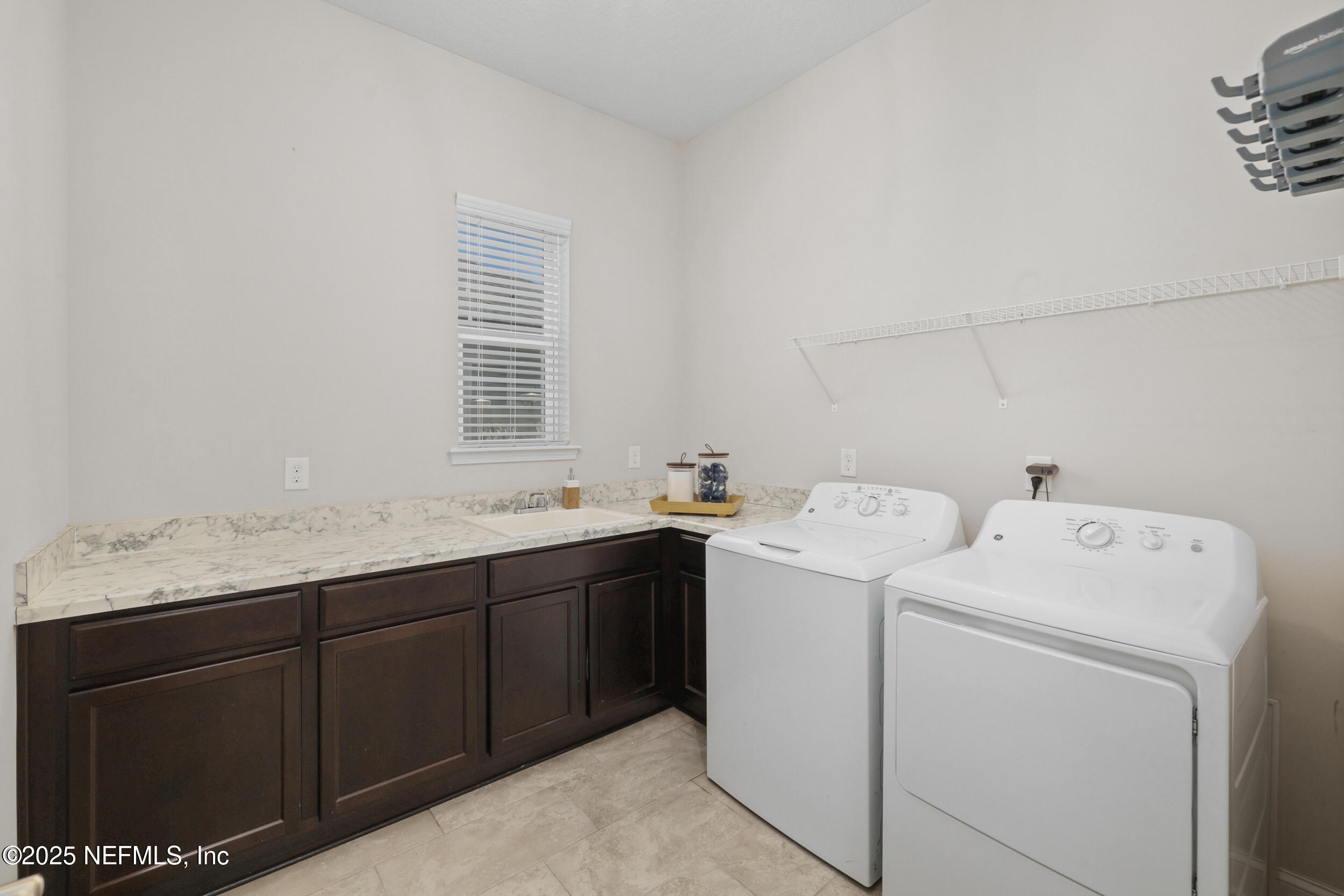 318 Windwalker Drive St. Augustine, FL 32092 - Photo 52 of 54 a utility room with dryer and washer