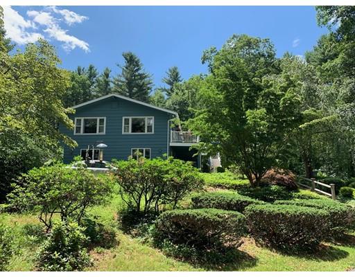356 Taylor Road Stow, MA 01775 - Photo 1 of 38 a view of a house with a yard and potted plants