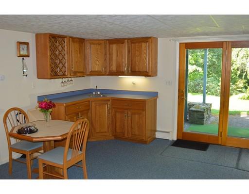 356 Taylor Road Stow, MA 01775 - Photo 8 of 38 a kitchen with a sink cabinets and dining table