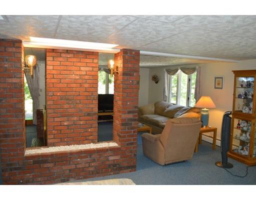 356 Taylor Road Stow, MA 01775 - Photo 10 of 38 a living room with fireplace furniture and a window