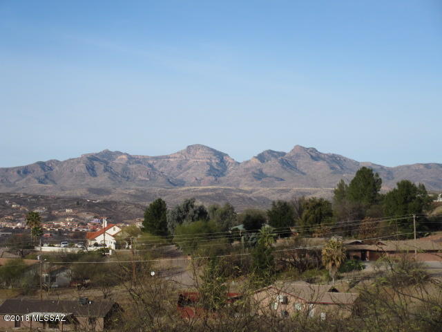 1196 Avenida Leon Rio Rico, AZ 85648 - Photo 6 of 25 a view of a lake with mountains in the background