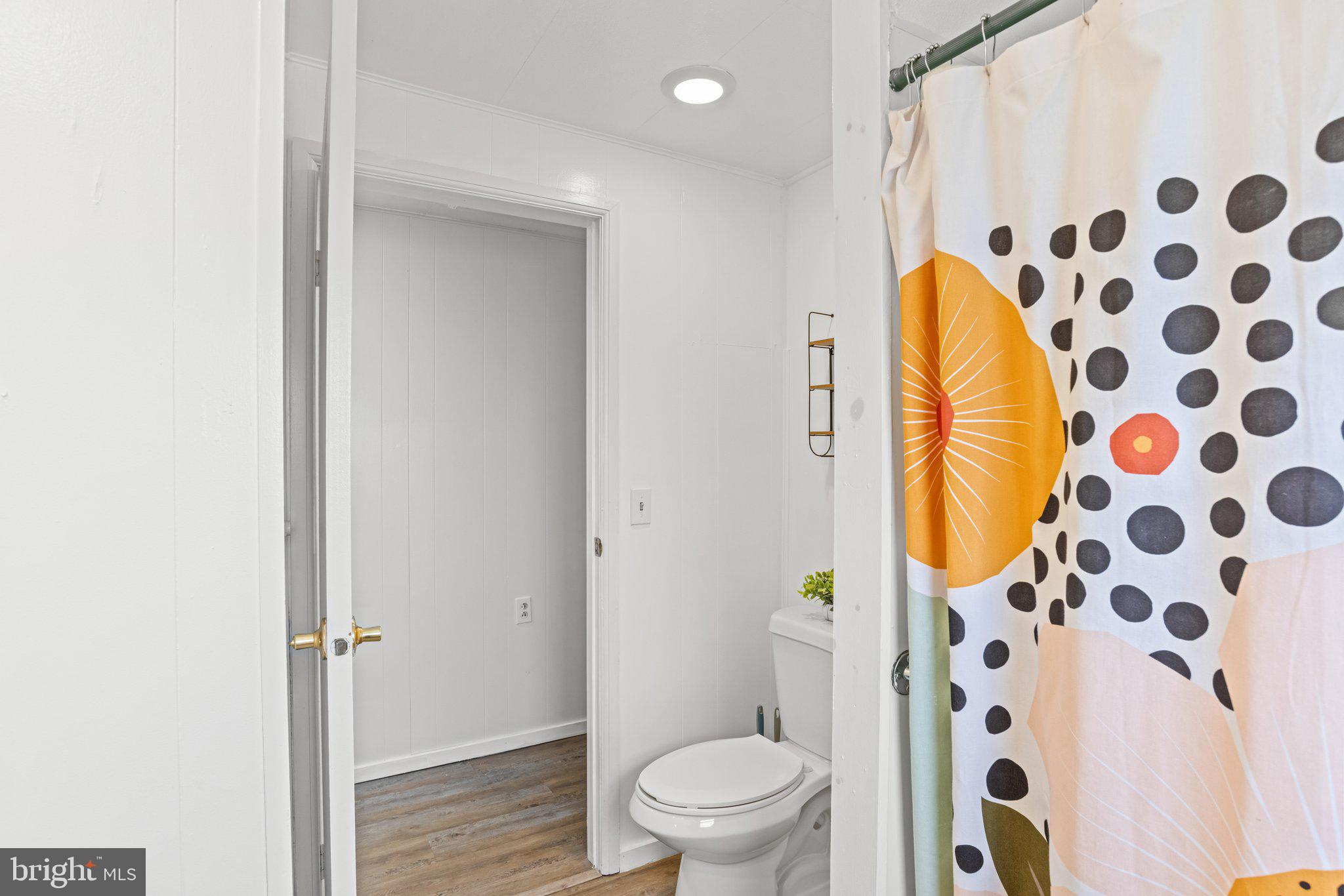 25 Ridgewood Manor Manheim, PA 17545 - Photo 24 of 36 a bathroom with a toilet and a shower curtain