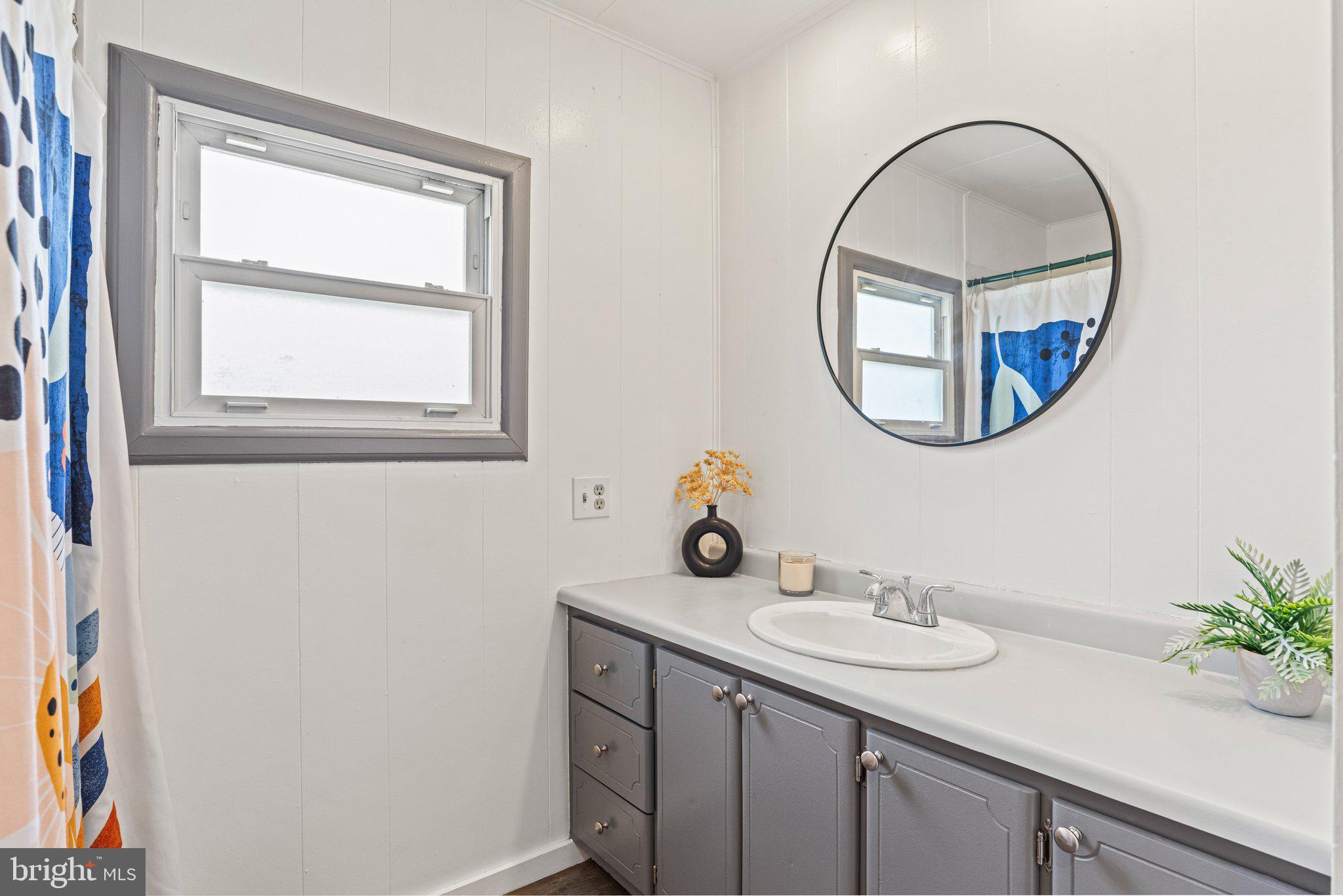 25 Ridgewood Manor Manheim, PA 17545 - Photo 25 of 36 a bathroom with a sink and a mirror