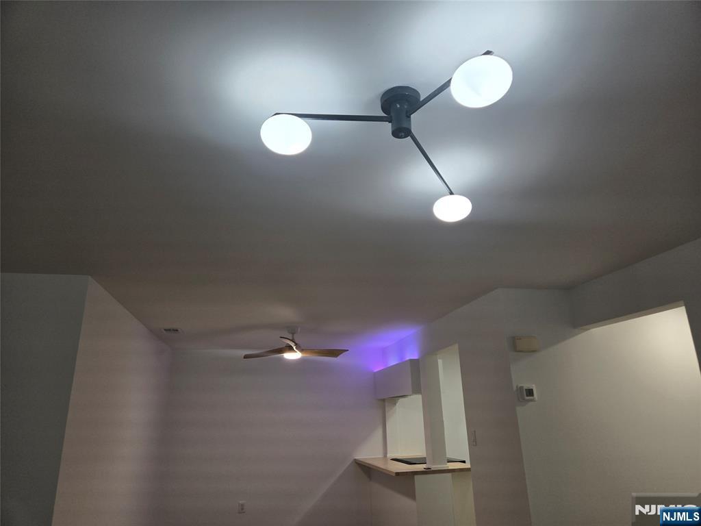 2080 Drake Court Mahwah, NJ 07430 - Photo 17 of 23 a view of a room with wooden floor and fan