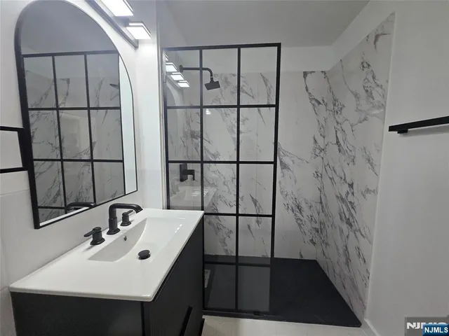 a bathroom with a sink and mirror