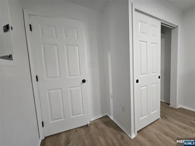 an empty room with wooden floor