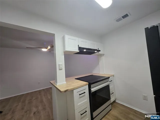 a kitchen with a stove and a microwave
